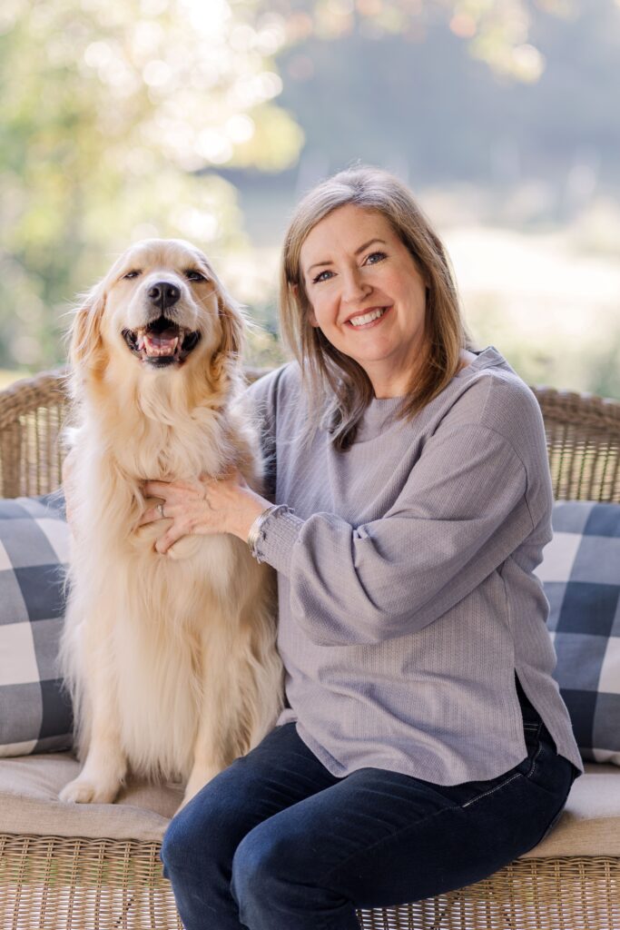 author McCall Hoyle with golden retriever dog named apple
